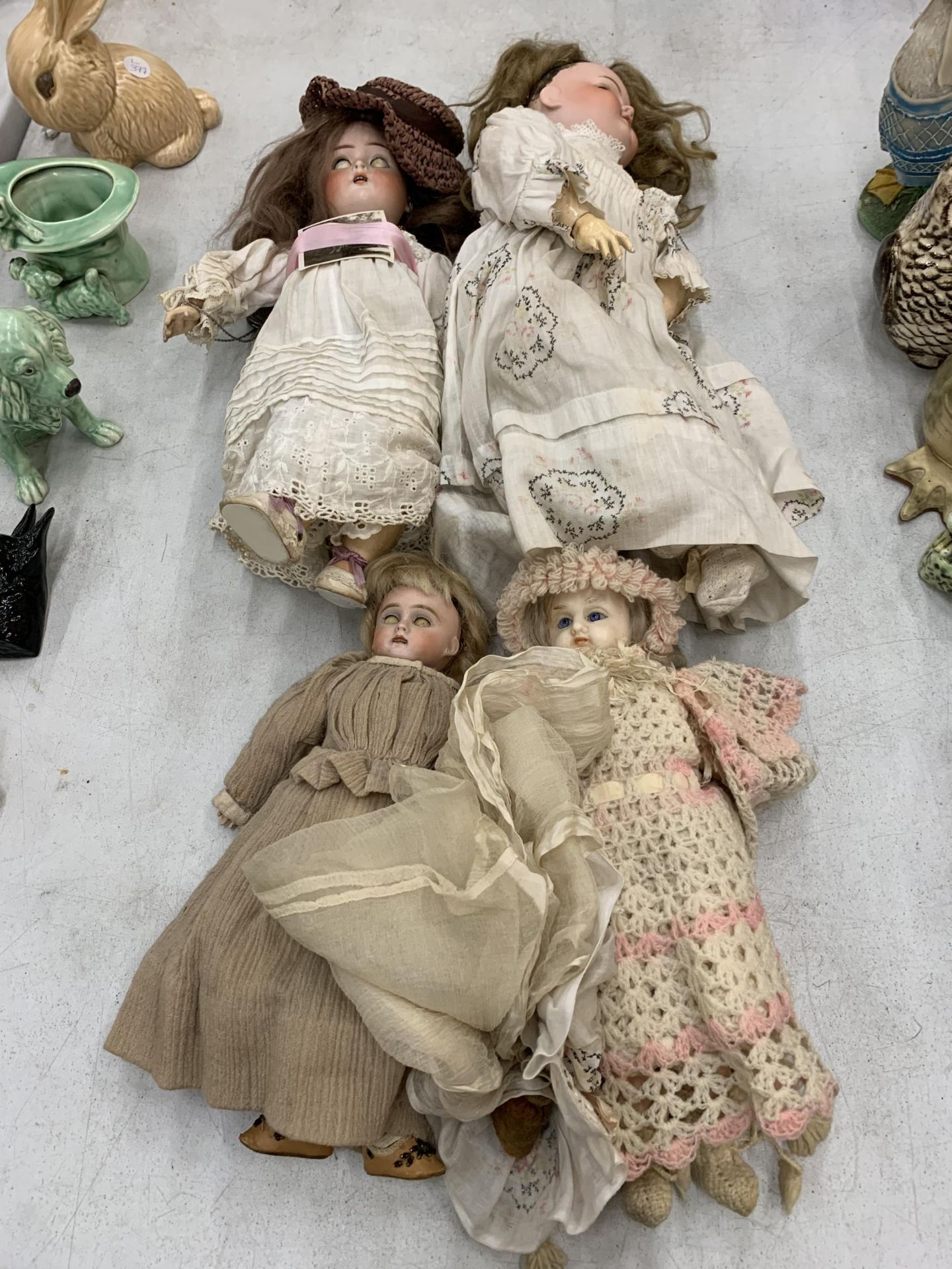 FOUR VINTAGE DOLLS, THREE WITH NAMES TO THE BACK OF THE HEADS, ONE WITH A PHOTO DATED AUGUST 1928,