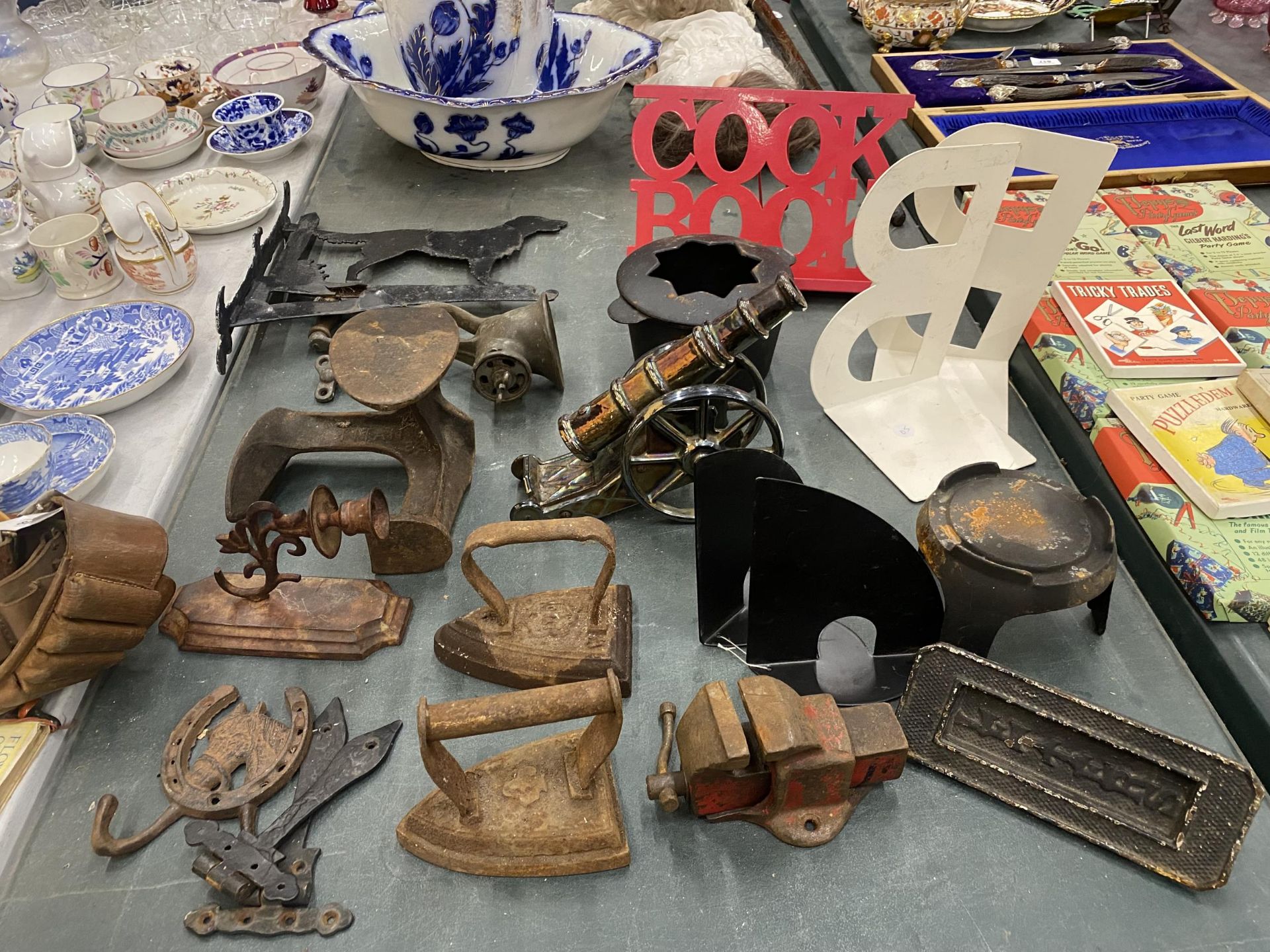 A LARGE QUANTITY OF VINTAGE ITEMS TO INCLUDE FLAT IRONS, A DOG WEATHER VANE, A LETTER BOX, WALL