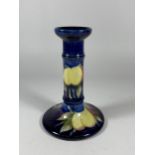 A MOORCROFT 'WISTERIA' BERRY PATTERN SHORT CANDLESTICK