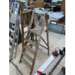 TWO VINTAGE WOODEN FOUR RUNG STEP LADDERS