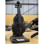 A BRONZE DOUBLE BASS DOOR STOP