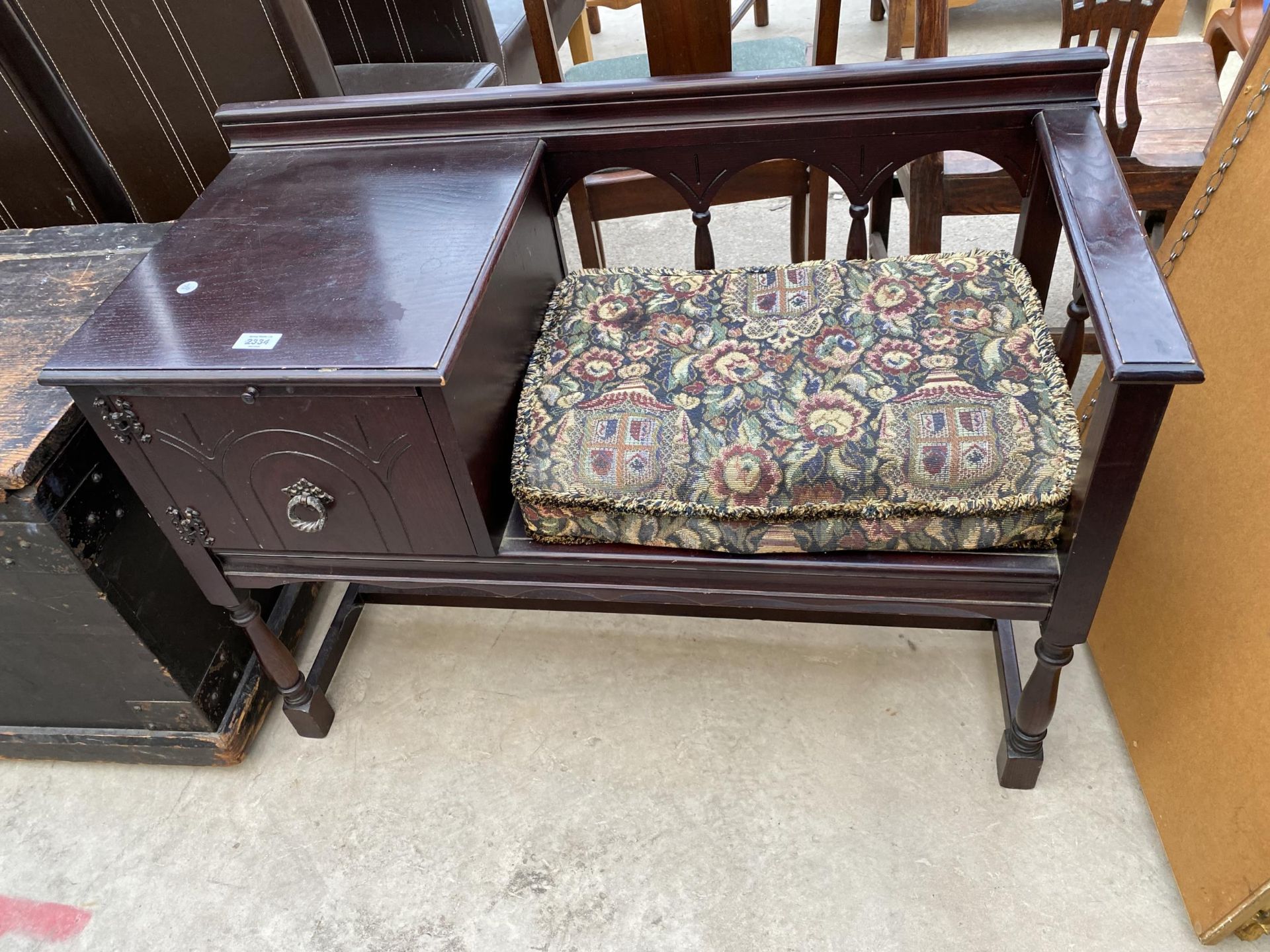 AN OAK 'CHIPPY TELEPHONE SEATS' TELEPHONE TABLE/SEAT