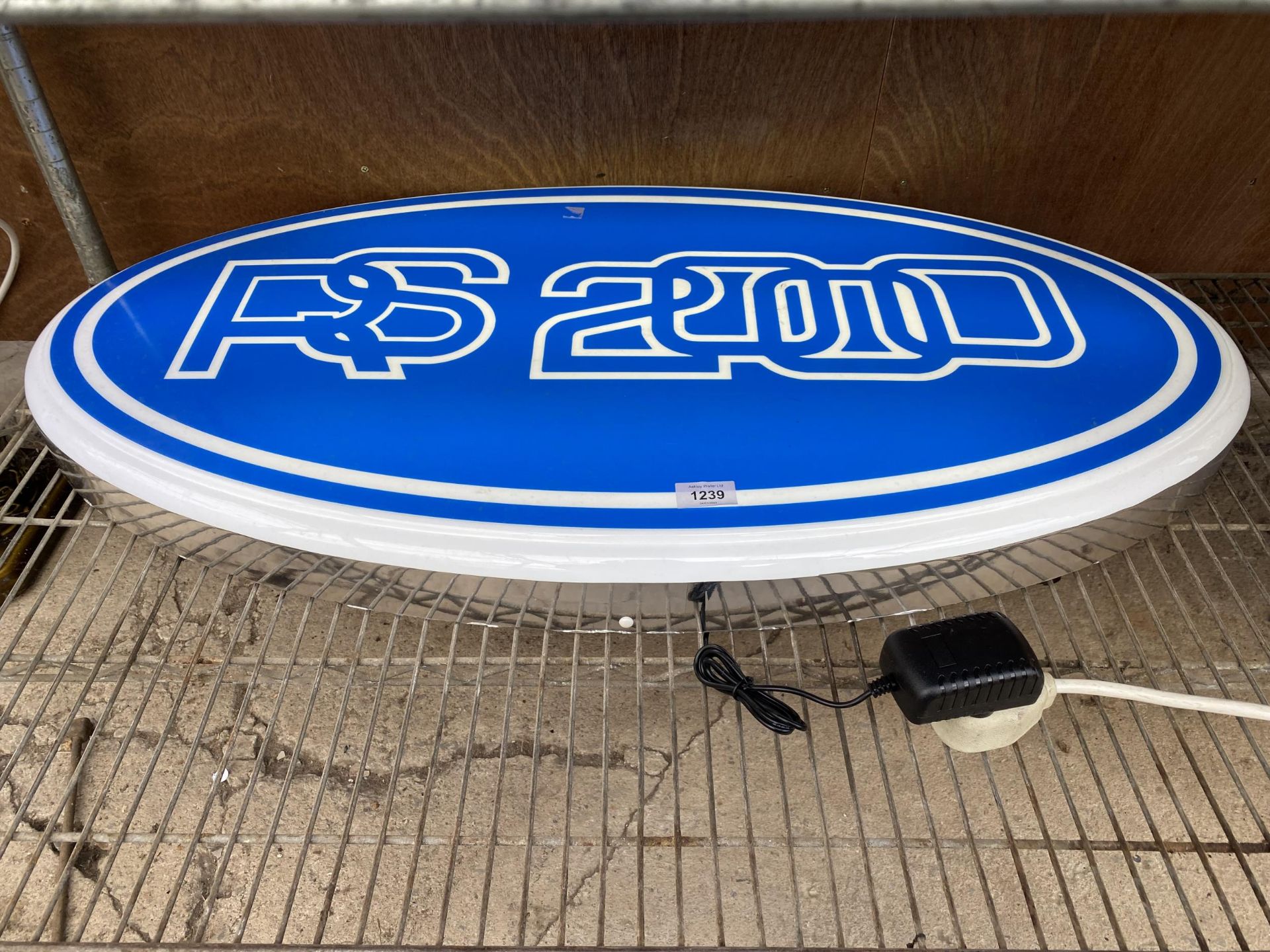 A LARGE OVAL RS2000 ILLUMINATED LIGHT BOX SIGN - WORKING ORDER AT TIME OF CATALOGUING. WIDTH 86CM,