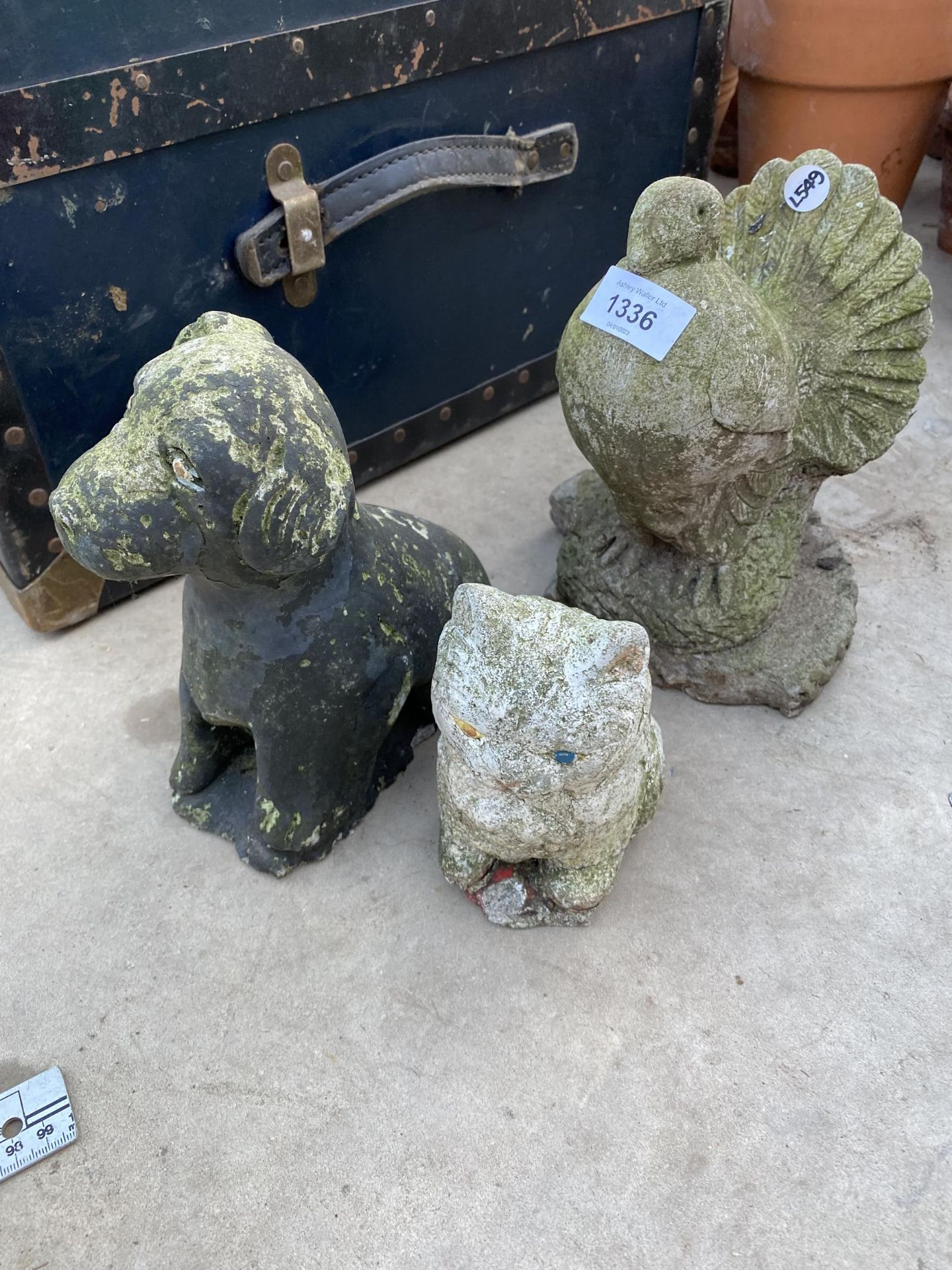 THREE RECONSTITUTED STONE GARDEN ORNAMENTS TO INCLUDE A CAT AND A DOVE ETC