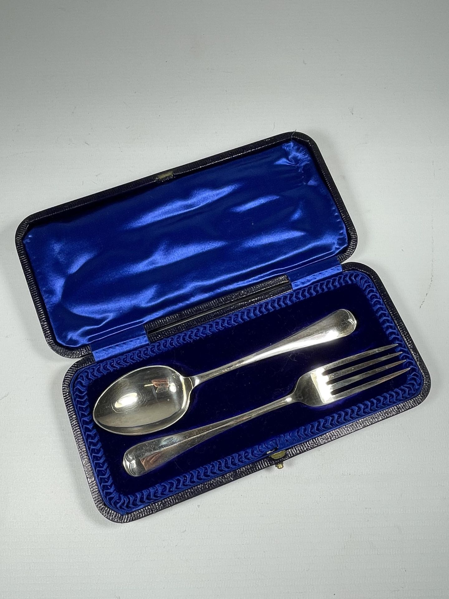 A GEORGE V SILVER CASED CHRISTENING SPOON & FORK SET, HALLMARKS FOR SHEFFIELD, 1930