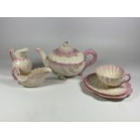 A BELLEEK CRESTED WARE CHINA SIX PIECE TEA SET COMPRISING TEAPOT, CUP & SAUCER TRIO, CREAM JUG &