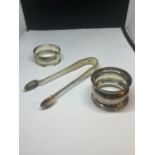 THREE SILVER ITEMS TO INCLUDE TWO HALLMARKED BIRMINGHAM SILVER NAPKIN RINGS ONE 1942 AND ONE
