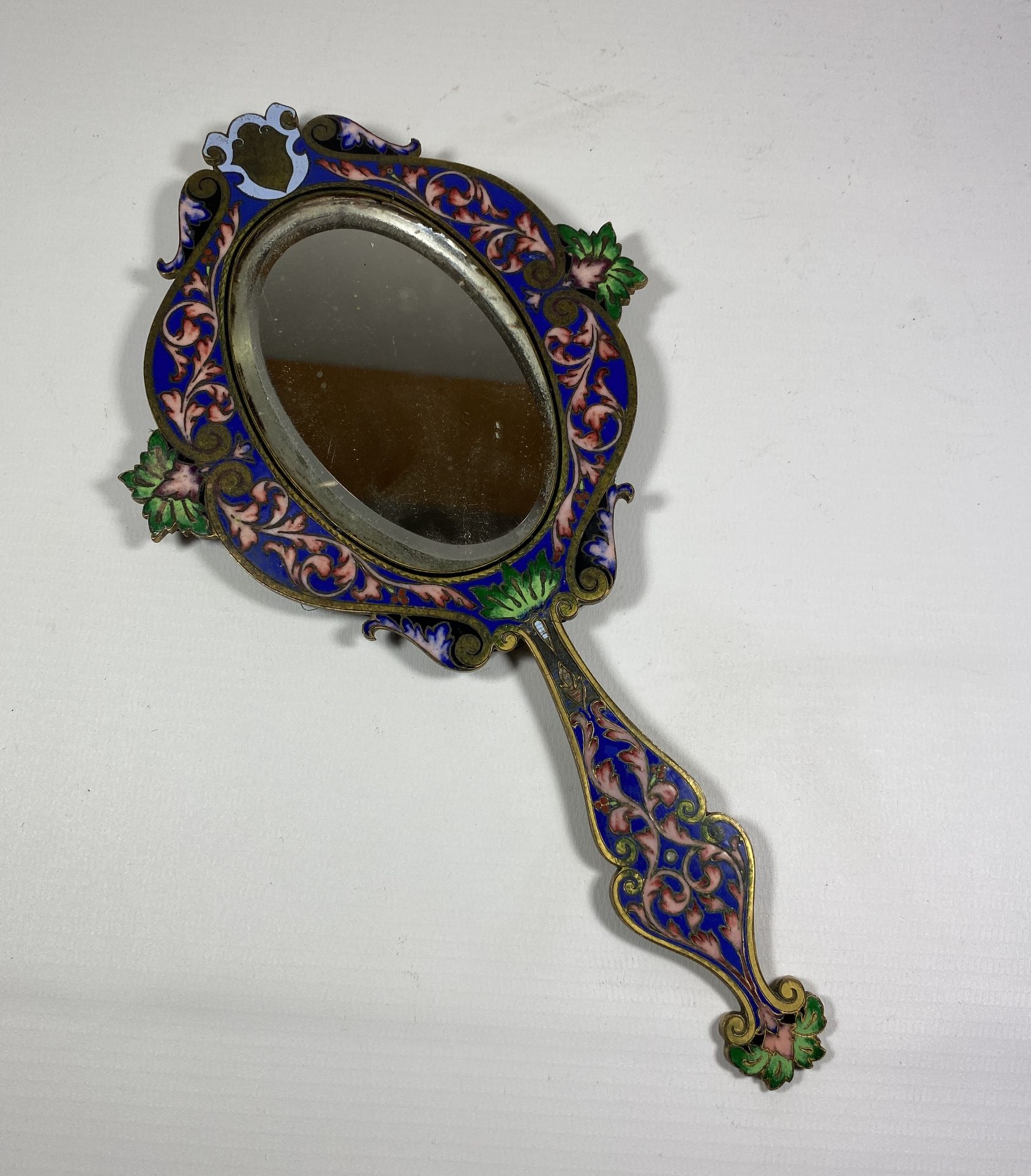 A 19TH CENTURY CHINESE CLOISONNE ENAMEL MIRROR, LENGTH 26CM