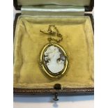 A 9 CARAT GOLD CAMEO WITH SAFETY CHAIN GROSS WEIGHT 3.12 GRAMS WITH A PRESENTATION BOX