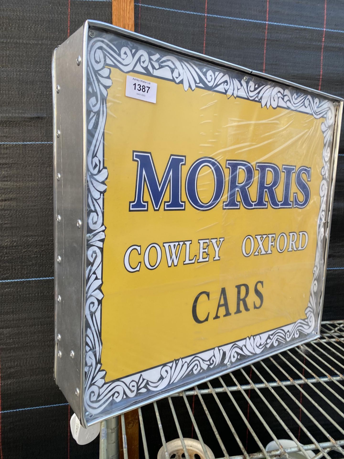 A SQUARE ILLUMINATED 'MORRIS' SIGN