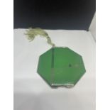 A BRITISH MADE ART DECO GREEN AND CHROME COMPACT WITH BEAUTIBOX PAD AND A TASSEL UNUSED AS NEW