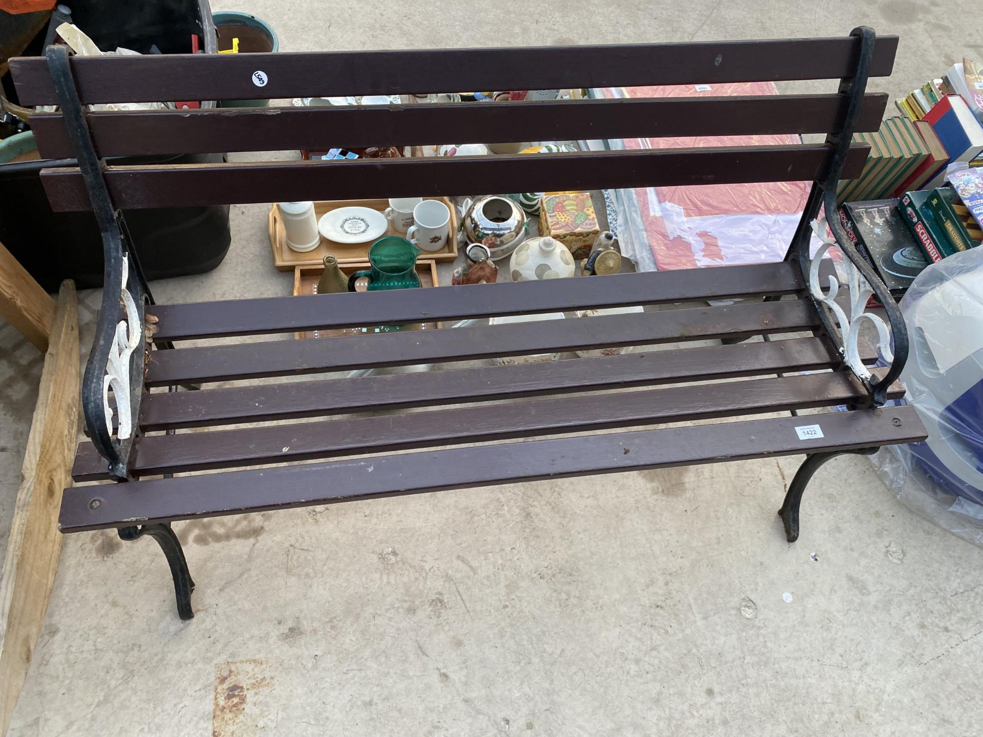 A WOODEN SLATTED GARDEN BENCH WITH CAST BENCH ENDS - Image 2 of 2