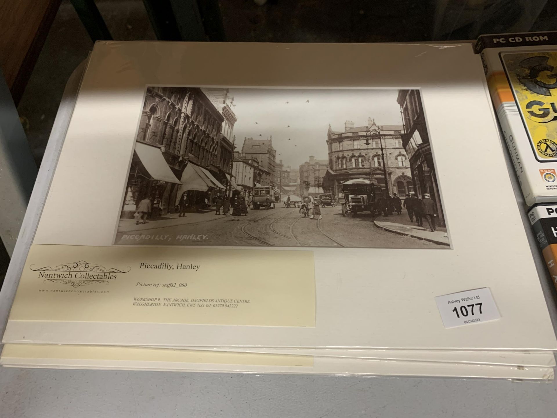 A COLLECTION OF HAND PRINTED SEPIA PHOTOGRAPHS IN CARDBOARD MOUNTS TO INCLUDE PICCADILLY, HANLEY,