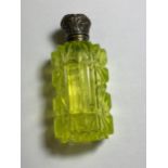A CUT GLASS AND AND WHITE METAL TOPPED PERFUME BOTTLE, BELIEVED SILVER