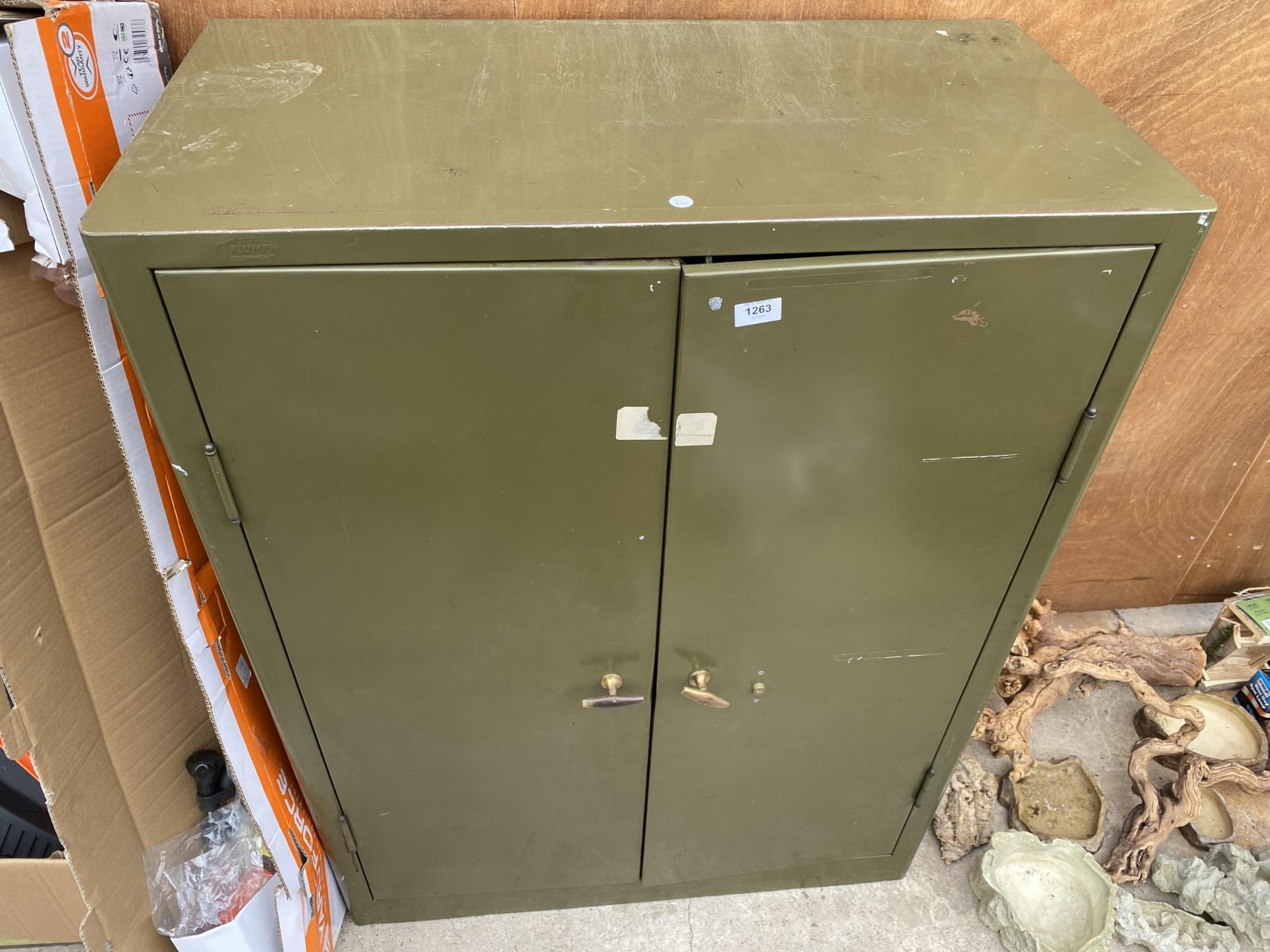 A VINTAGE GREEN METAL TWO DOOR STORAGE CUPBOARD