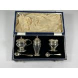 A CASED SILVER CONDIMENT SET COMPRISING MUSTARD POT & SPOON, PEPPERETTE & OPEN SALT & SPOON,