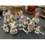 A COLLECTION OF CERAMIC SEWING/PIN CUSHION LADIES