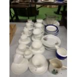 A LARGE QUANTITY OF WHITE CHINA CUPS, SAUCERS, PLATES, JUGS, ETC