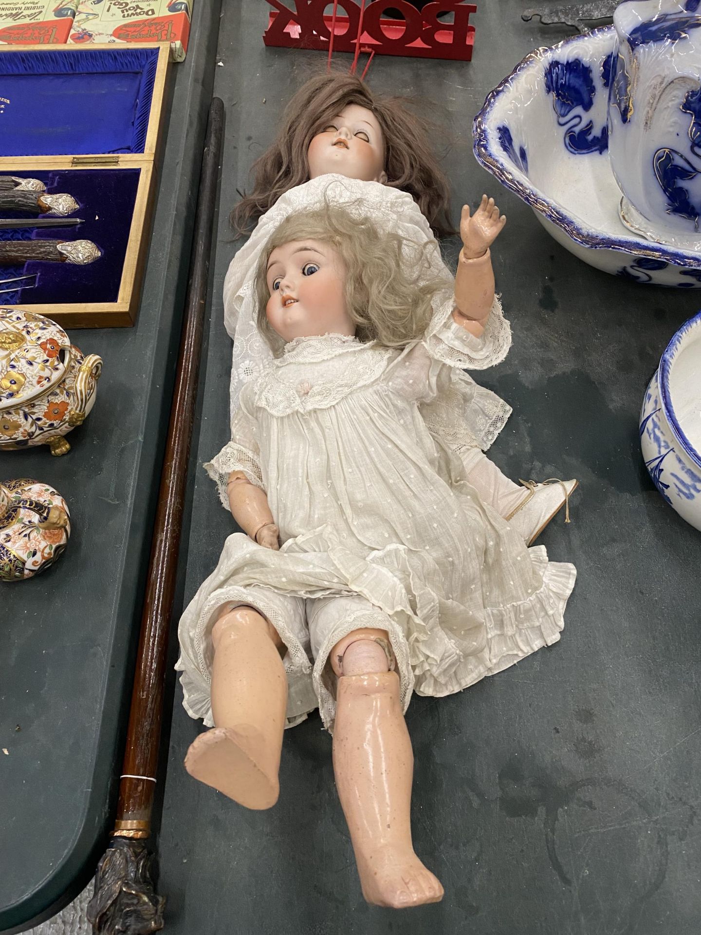 TWO LARGE VINTAGE DOLLS, ONE MARKED MAX HANDWERGY, GERMANY, THE OTHER MARKED HEUBACH KOPPELSDORF