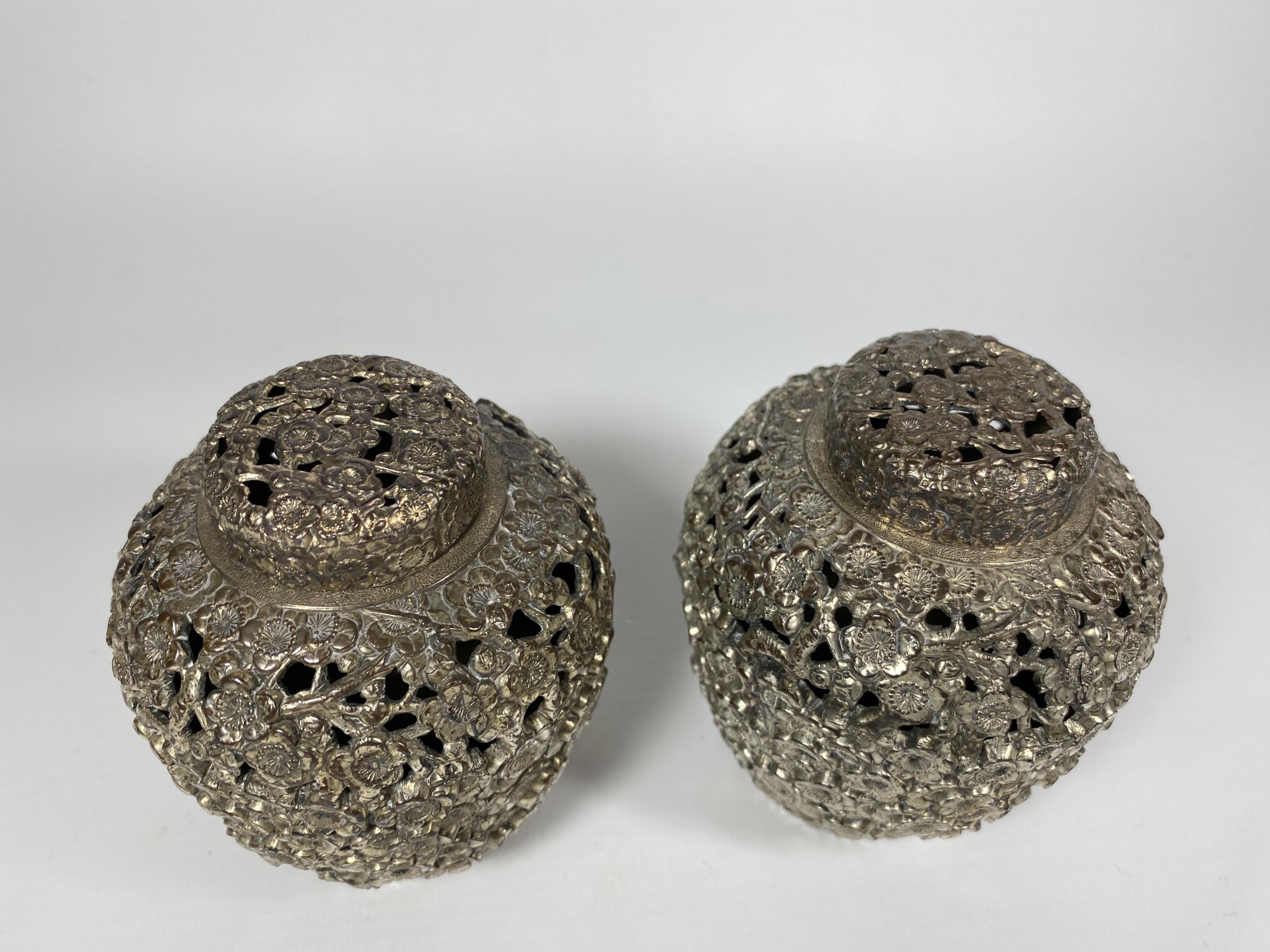 A PAIR OF UNUSUAL WHITE METAL, POSSIBLY CHINESE, LIDDED TEA CADDIES, HEIGHT 11CM - Image 2 of 3