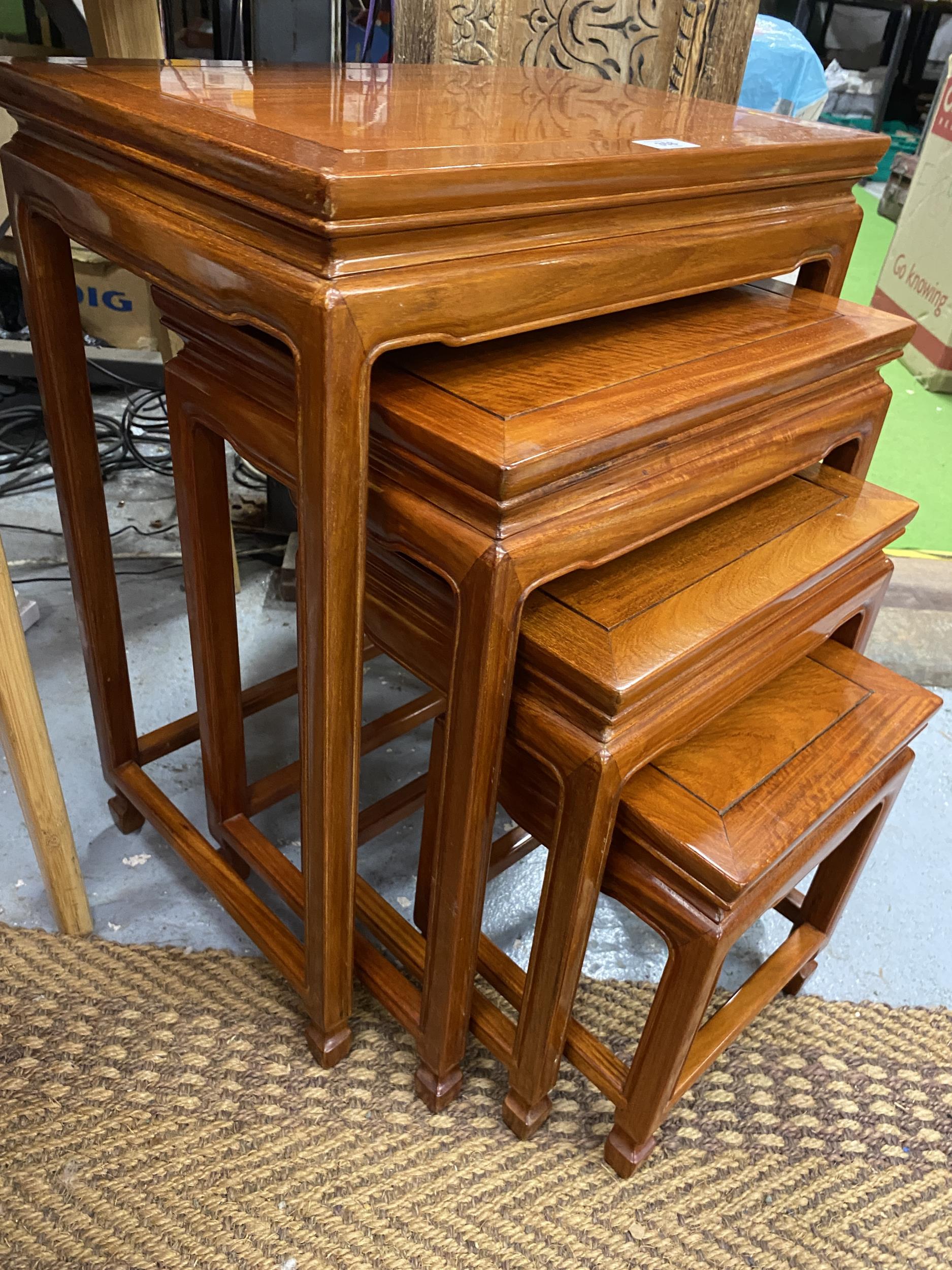 A SET OF FOUR CHINESE YEW WOOD NEST OF TABLES, 65 X 50 X 34.5CM - Image 3 of 3