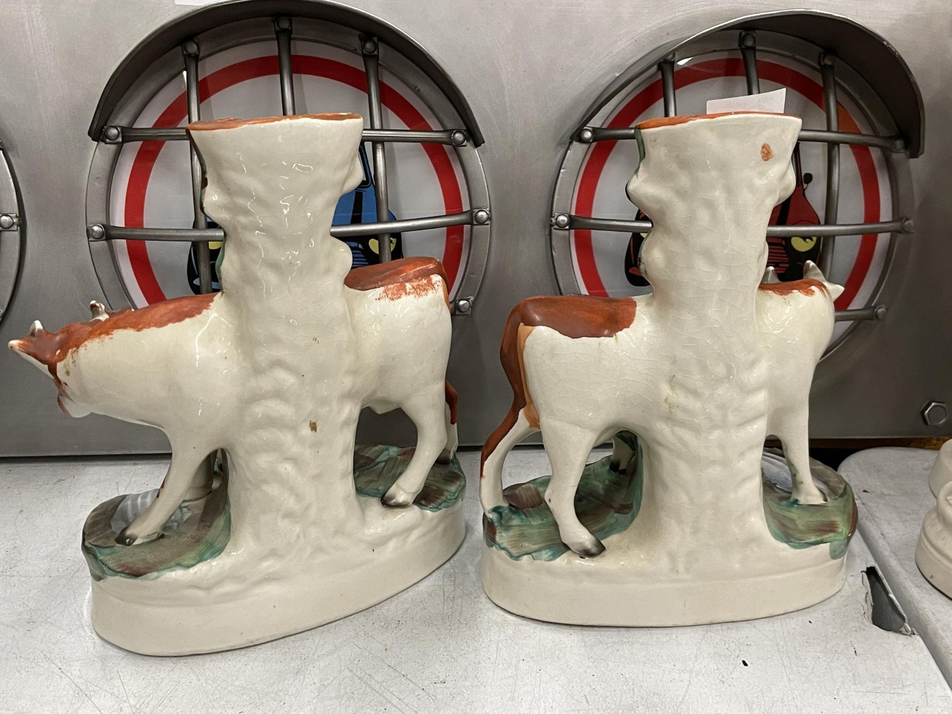 A PAIR OF 19TH CENTURY STAFFORDSHIRE POTTERY COW SPILL VASES - Image 2 of 3