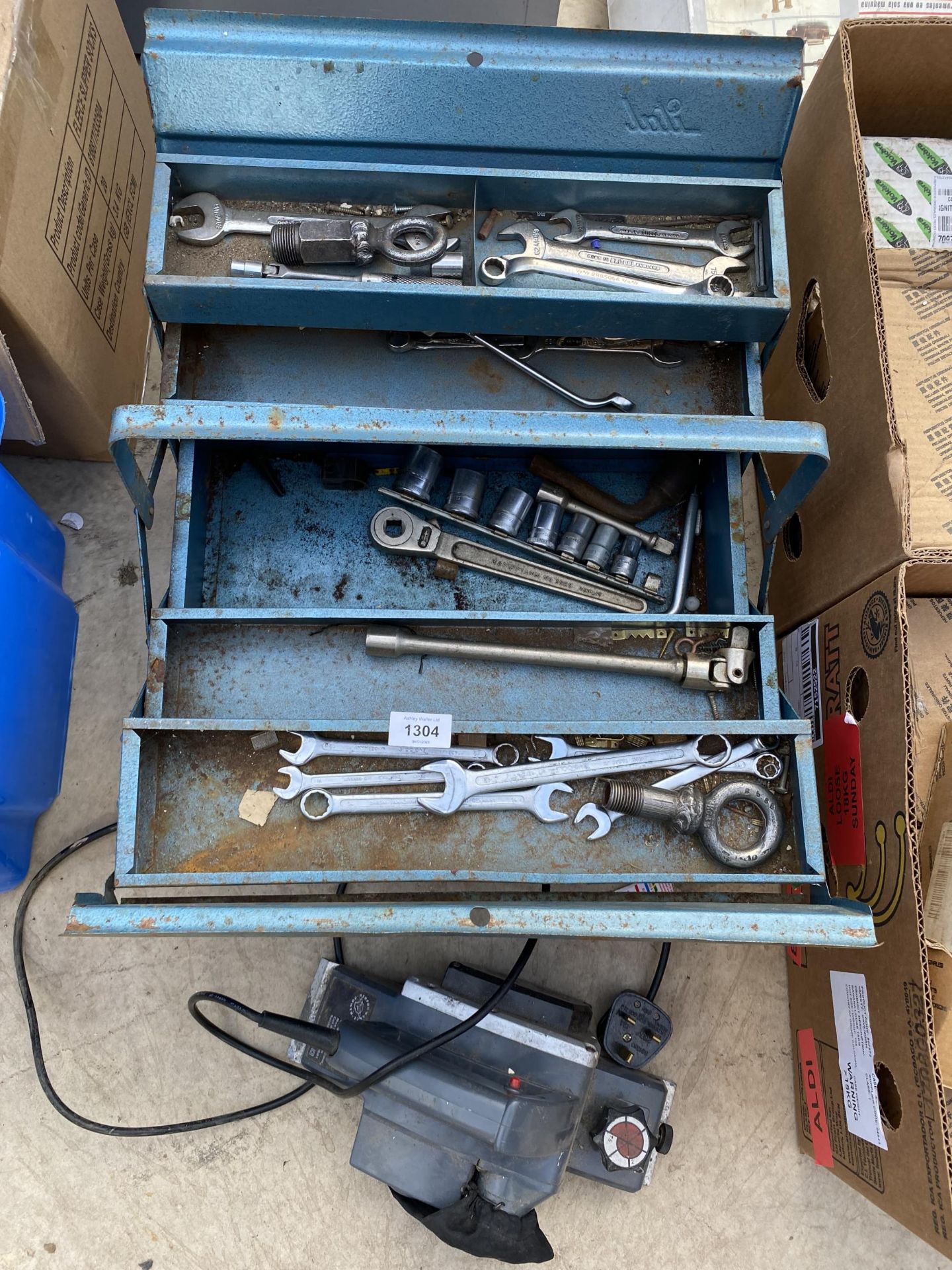 A METAL TOOL BOX CONTAINING AN ASSORTMENT OF TOOLS TO INCLUDE SPANNERS AND SOCKETS ETC