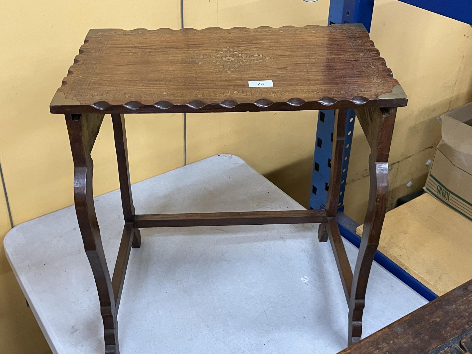 A BRASS INLAID WOODEN SIDE TABLE
