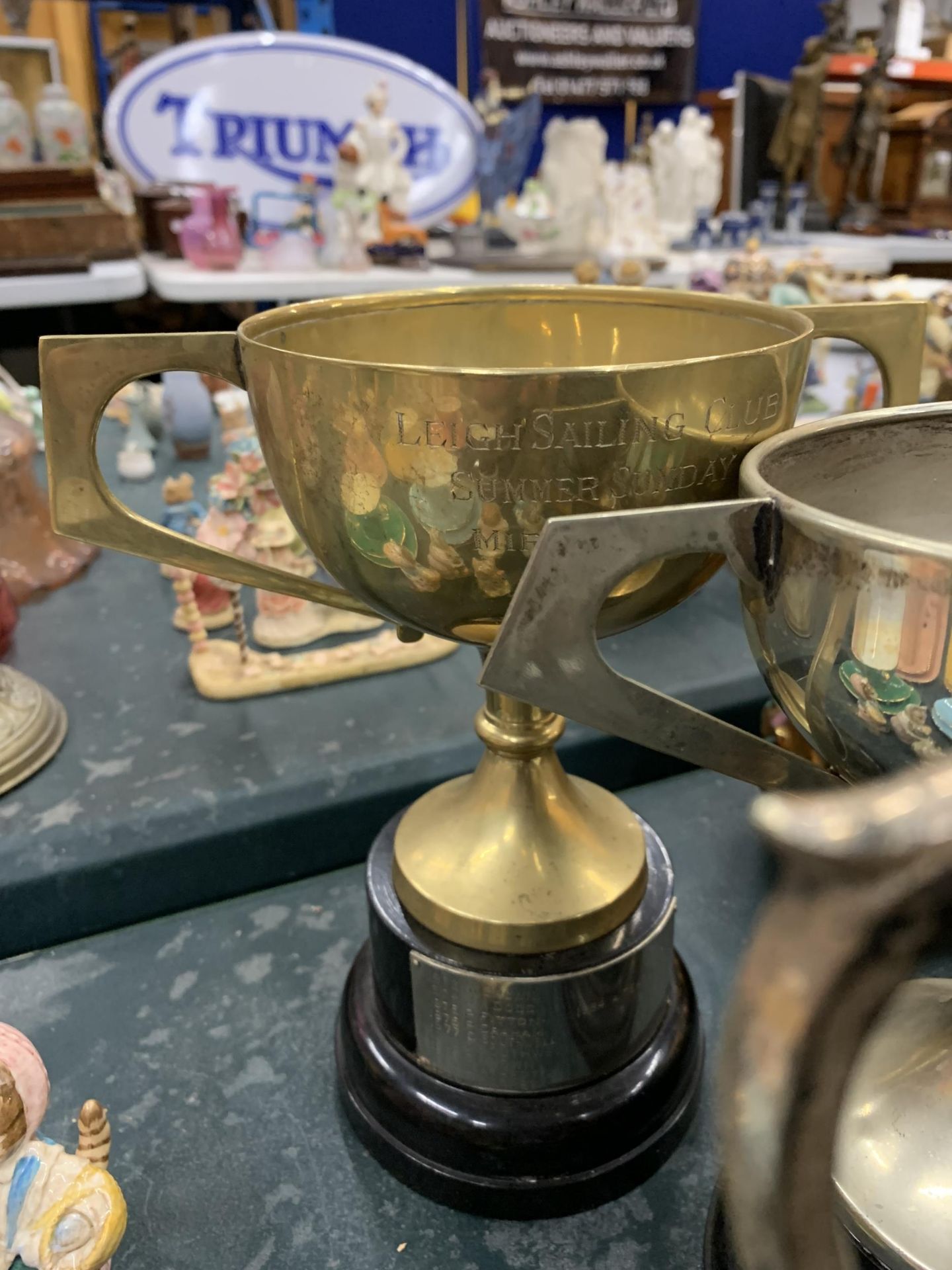 FOUR SILVER PLATED TROPHY CUPS ALL FROM LEIGH SAILING CLUB PLUS A BRASS TEAPOT - Image 4 of 4