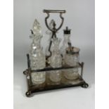 A SILVER PLATED CONDIMENT SET WITH CUT GLASS BOTTLES