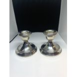A PAIR OF HALLMARKED BIRMINGHAM SILVER CANDLESTICKS WITH WEIGHTED BASES