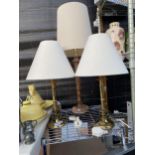 A PAIR OF BRASS TABLE LAMPS AND A FURTHER WOODEN TABLE LAMP ALL COMPLETE WITH SHADES