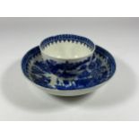 AN EARLY 19TH CENTURY BLUE AND WHITE ENGLISH PORCELAIN TEA BOWL & SAUCER