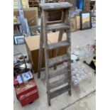 A VINTAGE SIX RUNG WOODEN STEP LADDER