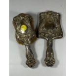 AN EDWARDIAN SILVER BACKED ART NOUVEAU TWO PIECE DRESSING SET COMPRISING BRUSH AND MIRROR, HALLMARKS