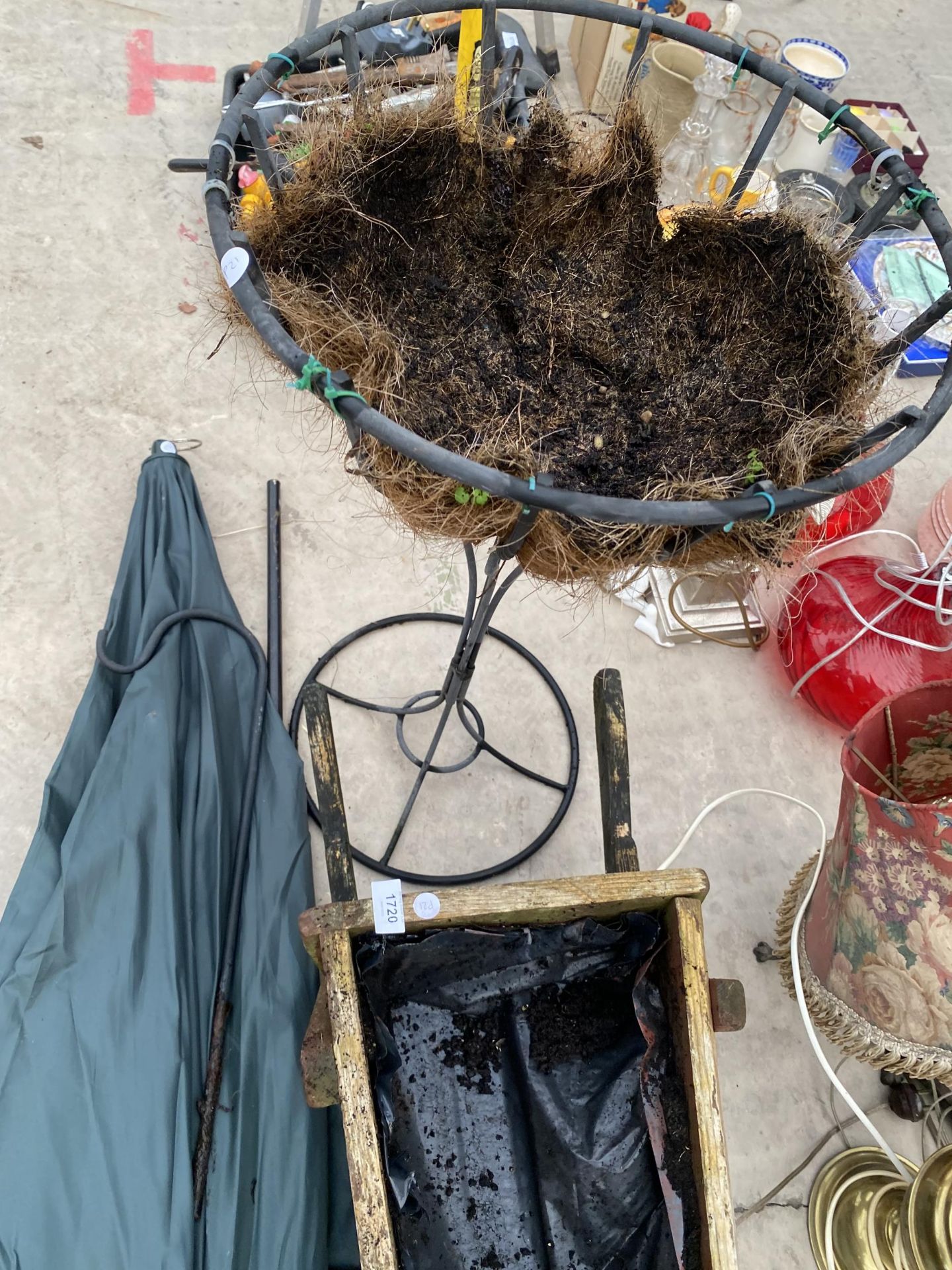 A WOODEN WHEEL BARROW PLANTER, A WROUGHT IRON PLANTER AND A FISHING BROLLY - Image 4 of 5