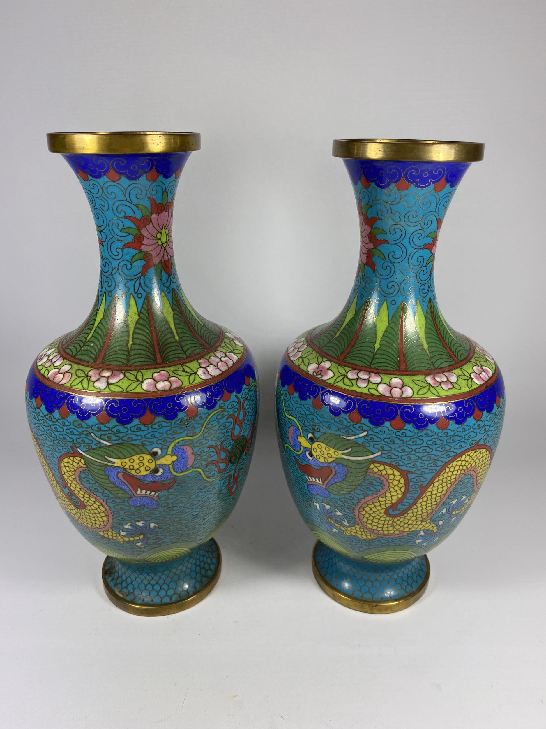 A PAIR OF CHINESE CLOISONNE BALUSTER FORM VASES WITH FIVE CLAW DRAGON CHASING THE FLAMING PEARL