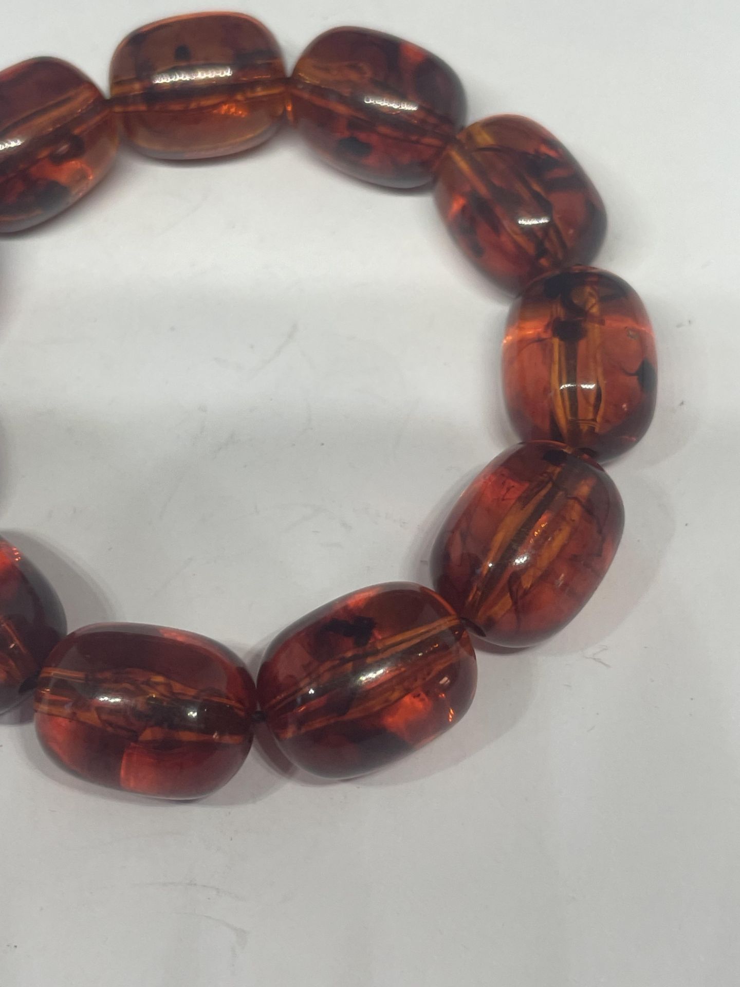 AN AMBER BRACELET - Image 2 of 2