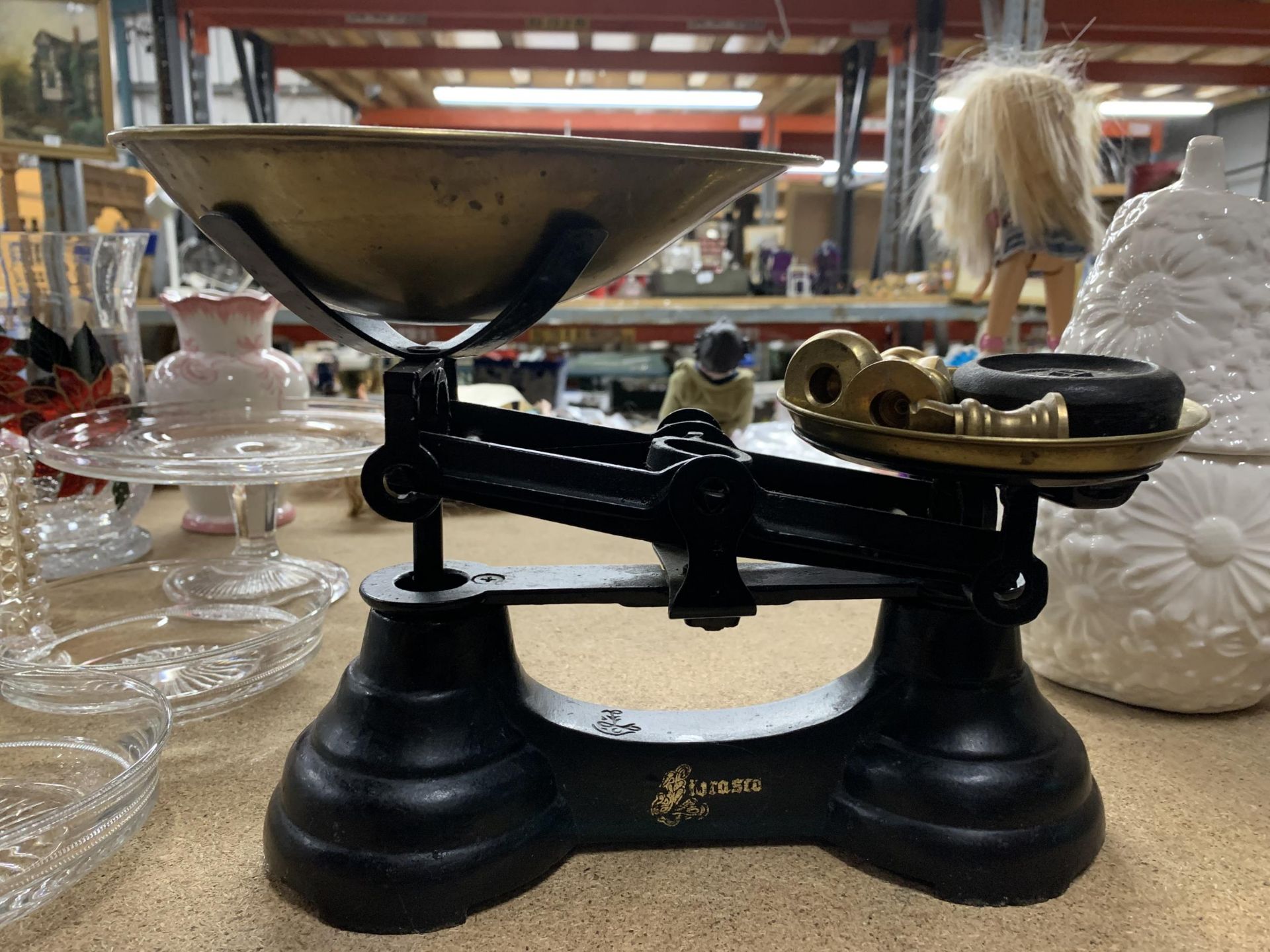 A SET OF CAST SCALES WITH BRASS PAN AND WEIGHTS