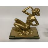 A METAL ART DECO STYLE GOLD COLOURED FIGURE 'RING LADY' HEIGHT 23CM, LENGTH 24CM