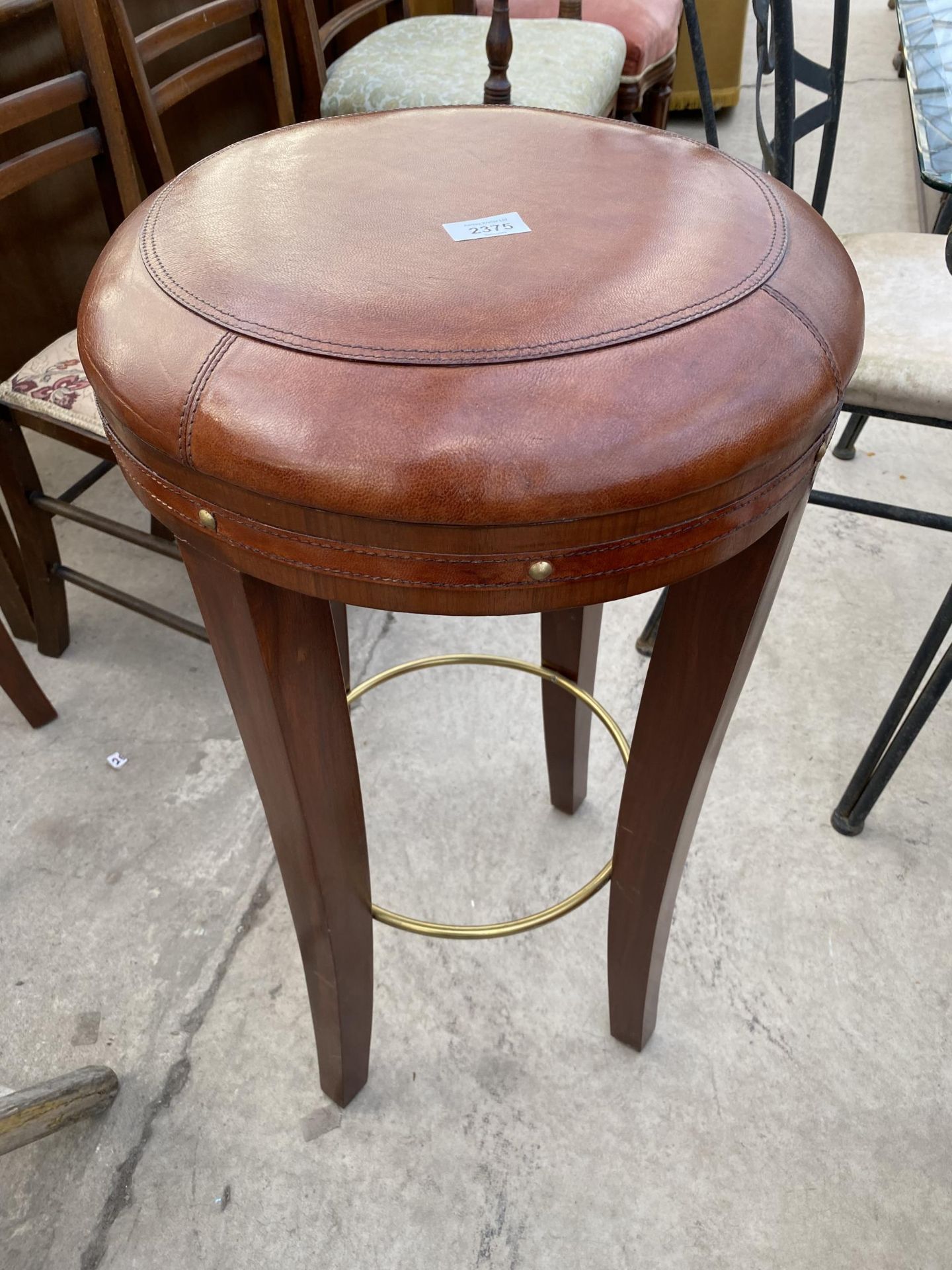 A 'NICKY CORNELL' BAR STOOL WITH LEATHER TOP