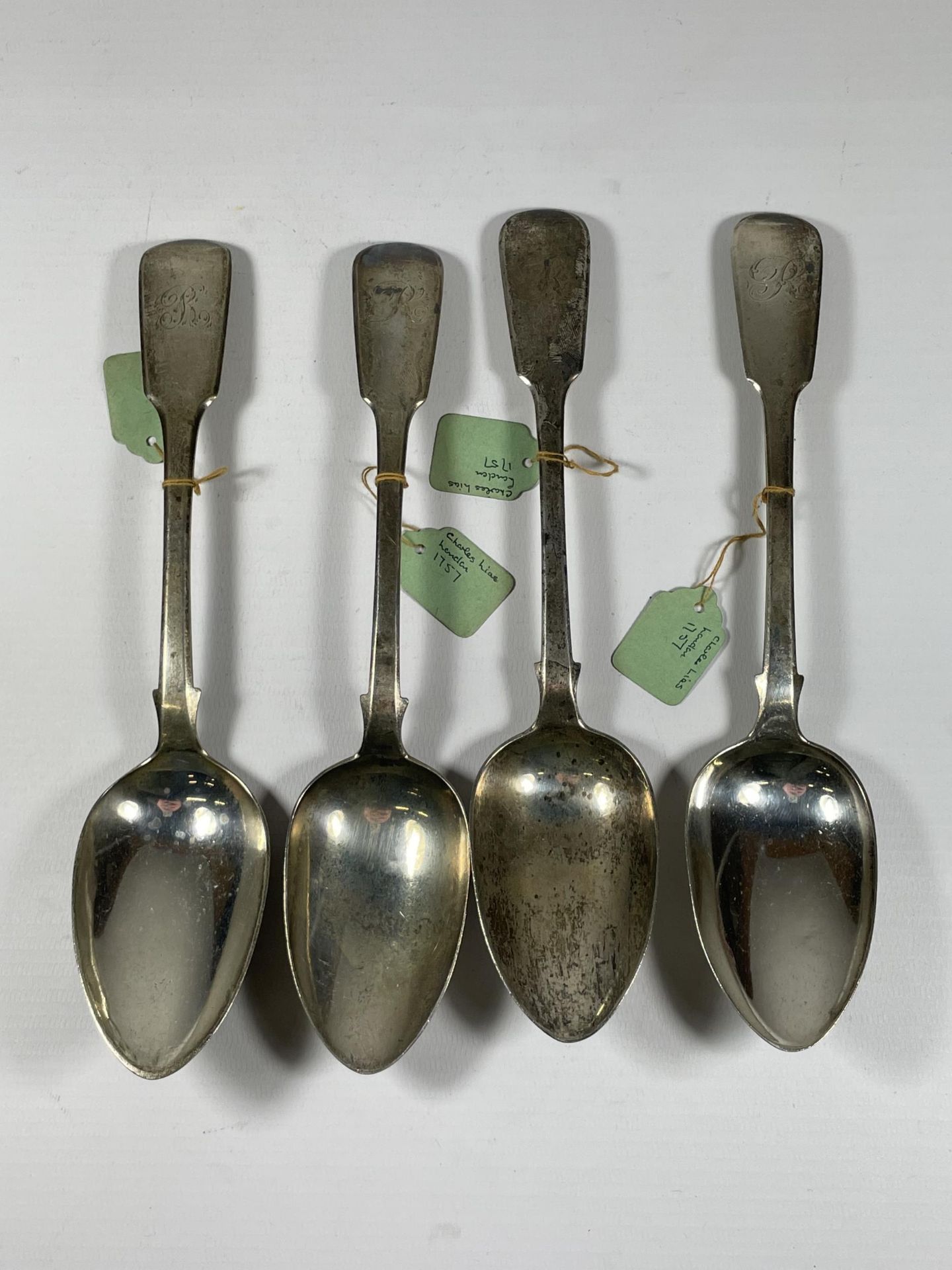 FOUR GEORGIAN SILVER TABLESPOONS COMPRISING THREE GEORGE II, CHARLES LIAS EXAMPLES WITH HALLMARKS