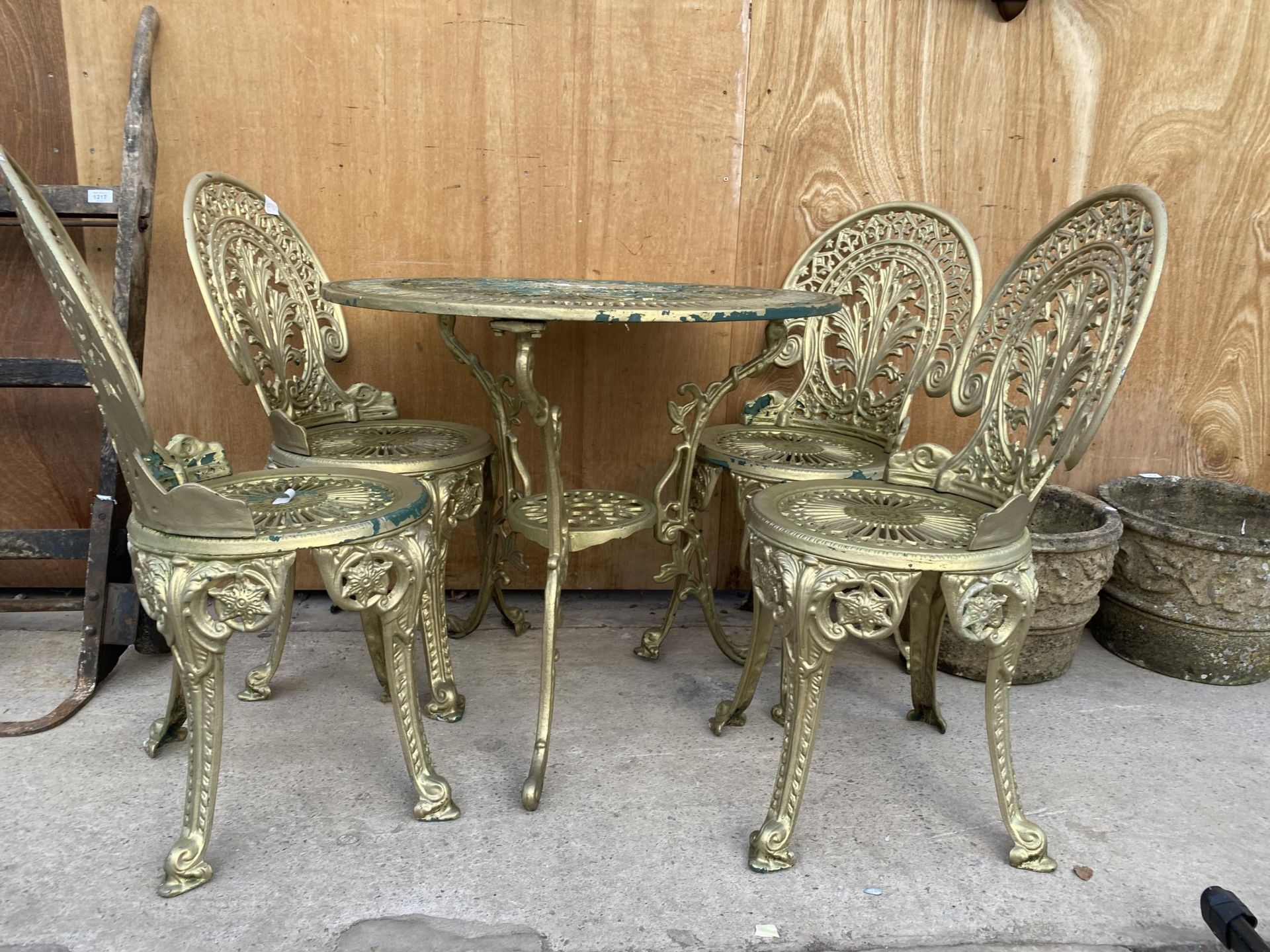 A VINTAGE STYLE CAST ALLOY BISTRO SET COMPRISING OF A ROUND TABLE AND FOUR CHAIRS - Image 3 of 4