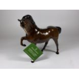 A ROYAL DOULTON BROWN GLOSS PRANCING MARE FIGURE WITH TAG