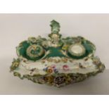 A VICTORIAN ORNATE CERAMIC INKWELL WITH EMBOSSED FLOWERS - A/F