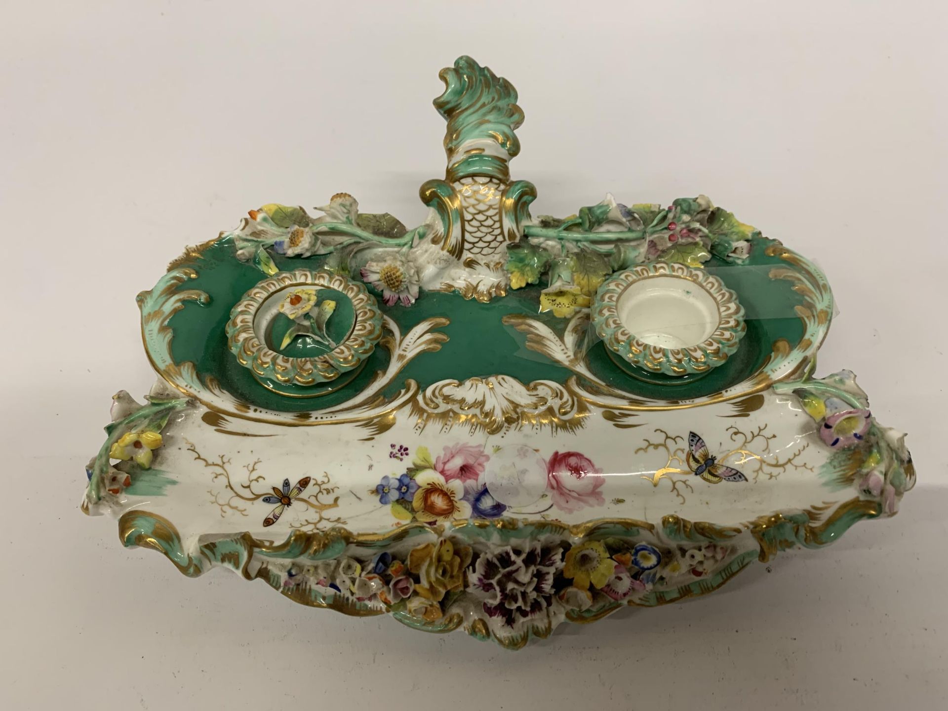 A VICTORIAN ORNATE CERAMIC INKWELL WITH EMBOSSED FLOWERS - A/F