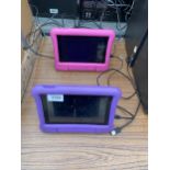TWO KINDLE TABLETS COMPLETE WITH RUBBER CASES AND CHARGER LEADS