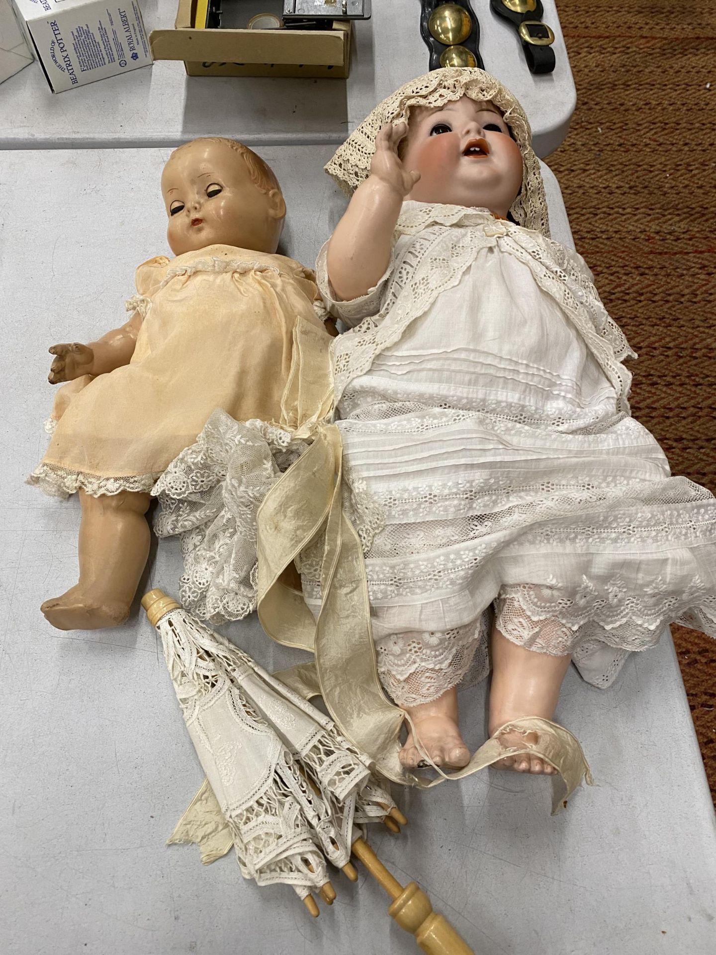 TWO VINTAGE DOLLS, ONE LARGE WITH A CERAMIC HEAD MARKED GERMANY, THE OTHER MARKED 'ROSEBUD'