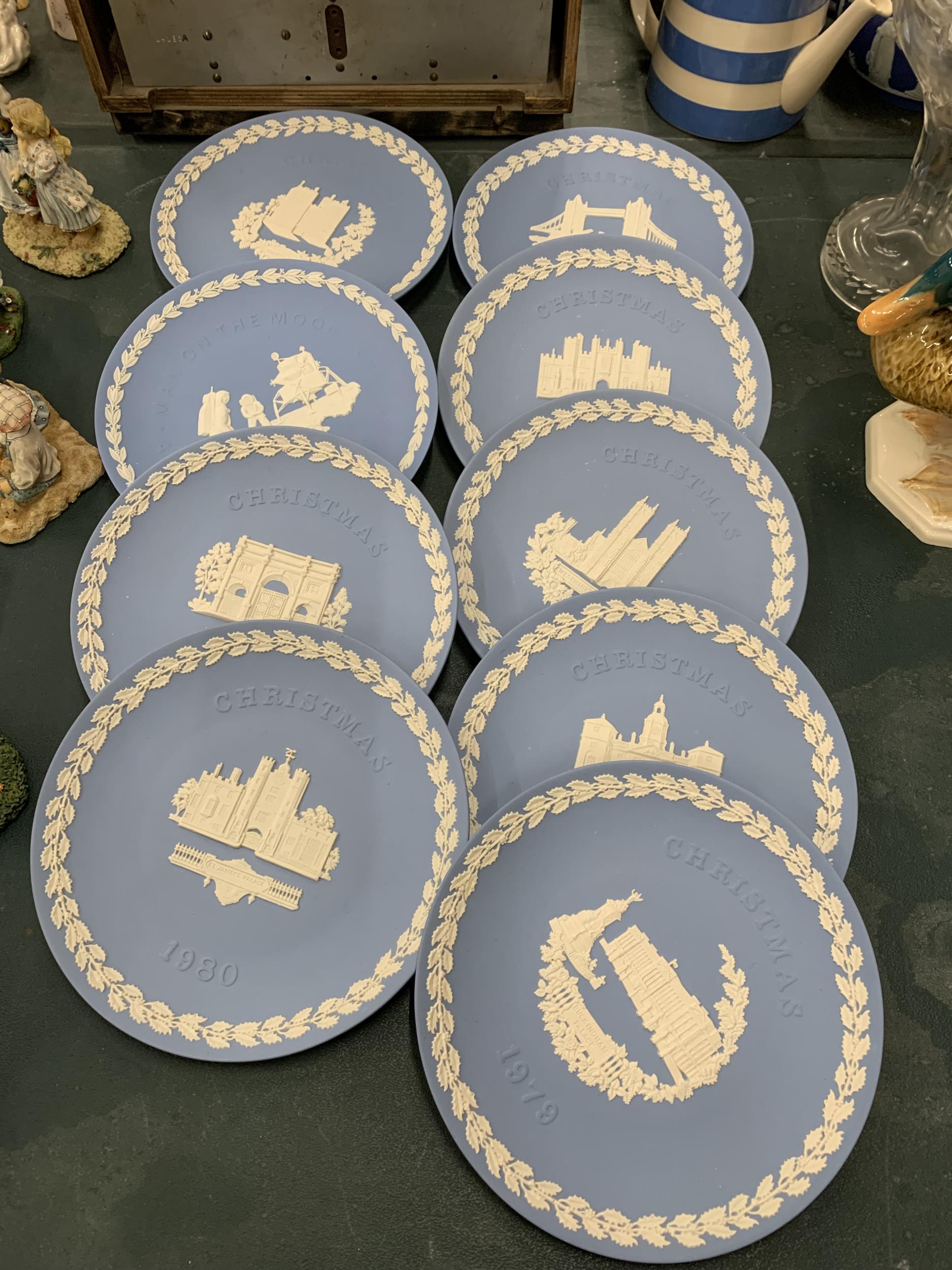 A COLLECTION OF WEDGWOOD JASPERWARE CHRISTMAS PLATES PLUS ONE TO COMMEMORATE THE FIRST MAN ON THE