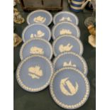 A COLLECTION OF WEDGWOOD JASPERWARE CHRISTMAS PLATES PLUS ONE TO COMMEMORATE THE FIRST MAN ON THE